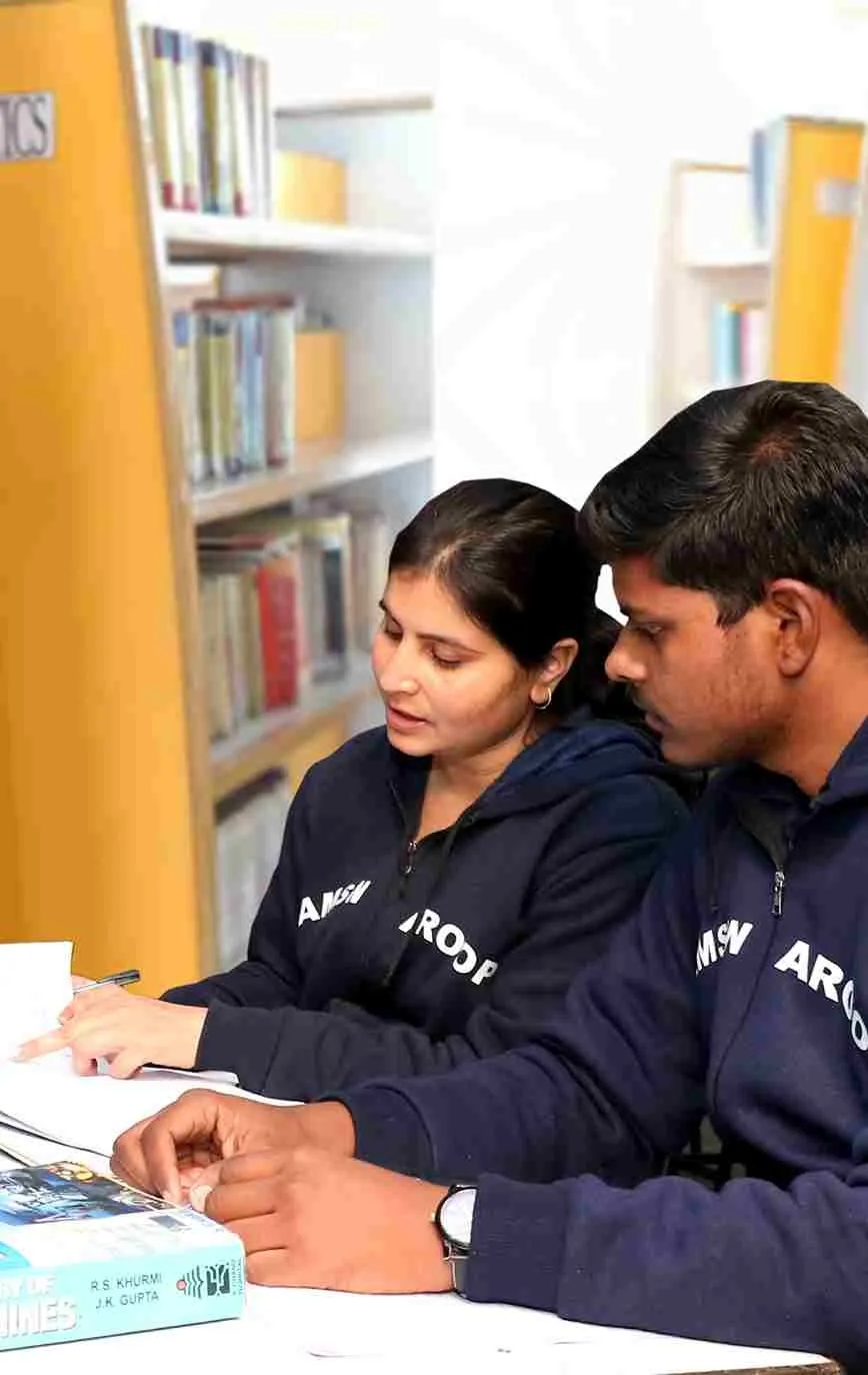 Students studying in a library after 12th class